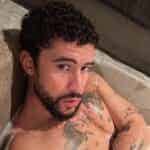 You’ll Need a Cold Shower After Seeing Bad Bunny’s Naked Bathtub Photos